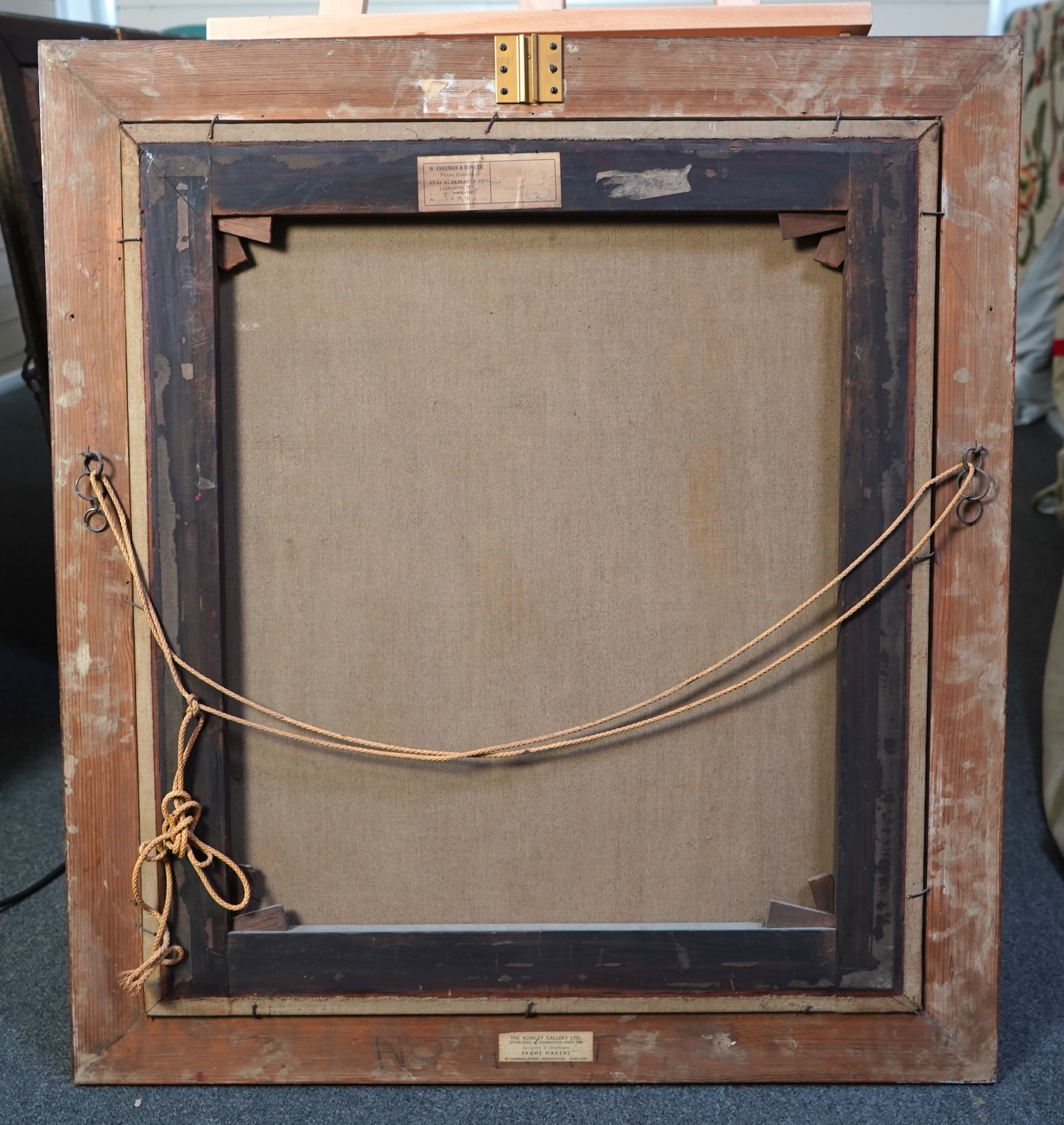 Follower of George Romney, British 1734-1802, A portrait of a young lady with yellow drapery